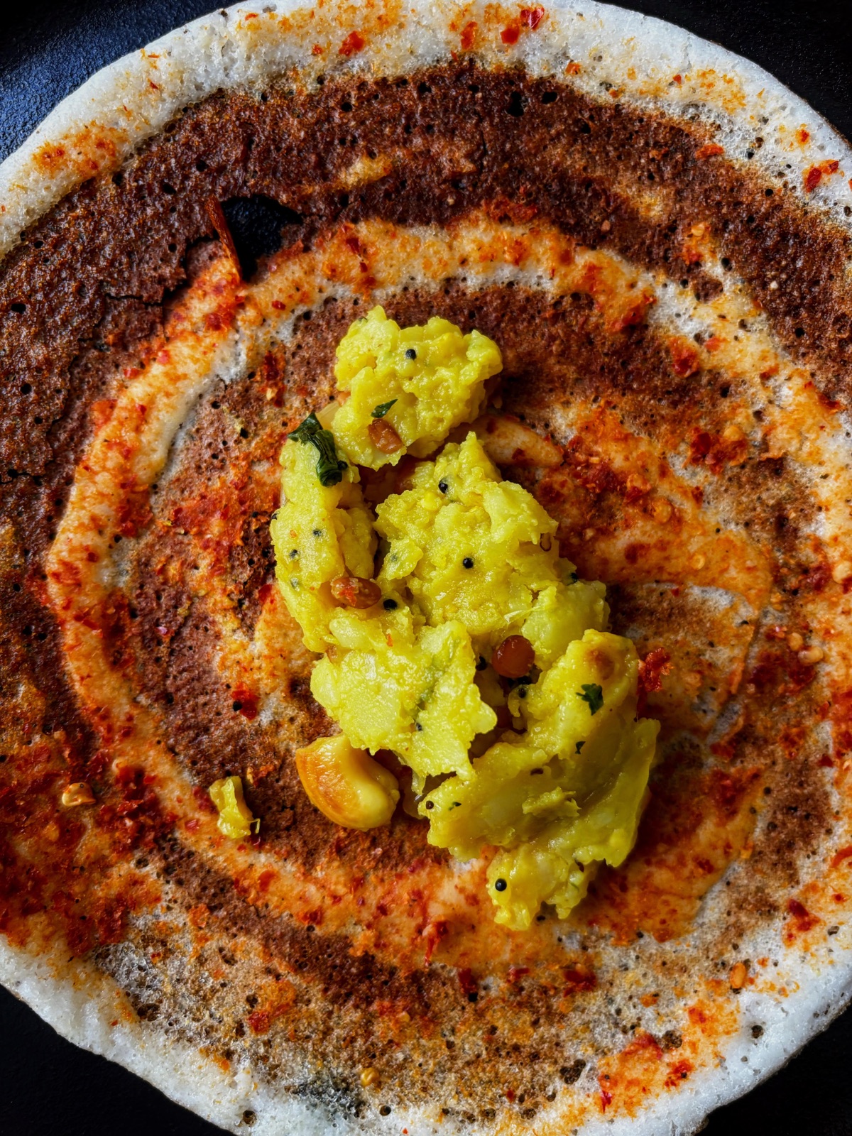 A masala dosa with spiced potato filling and chutney from Dosa Rush