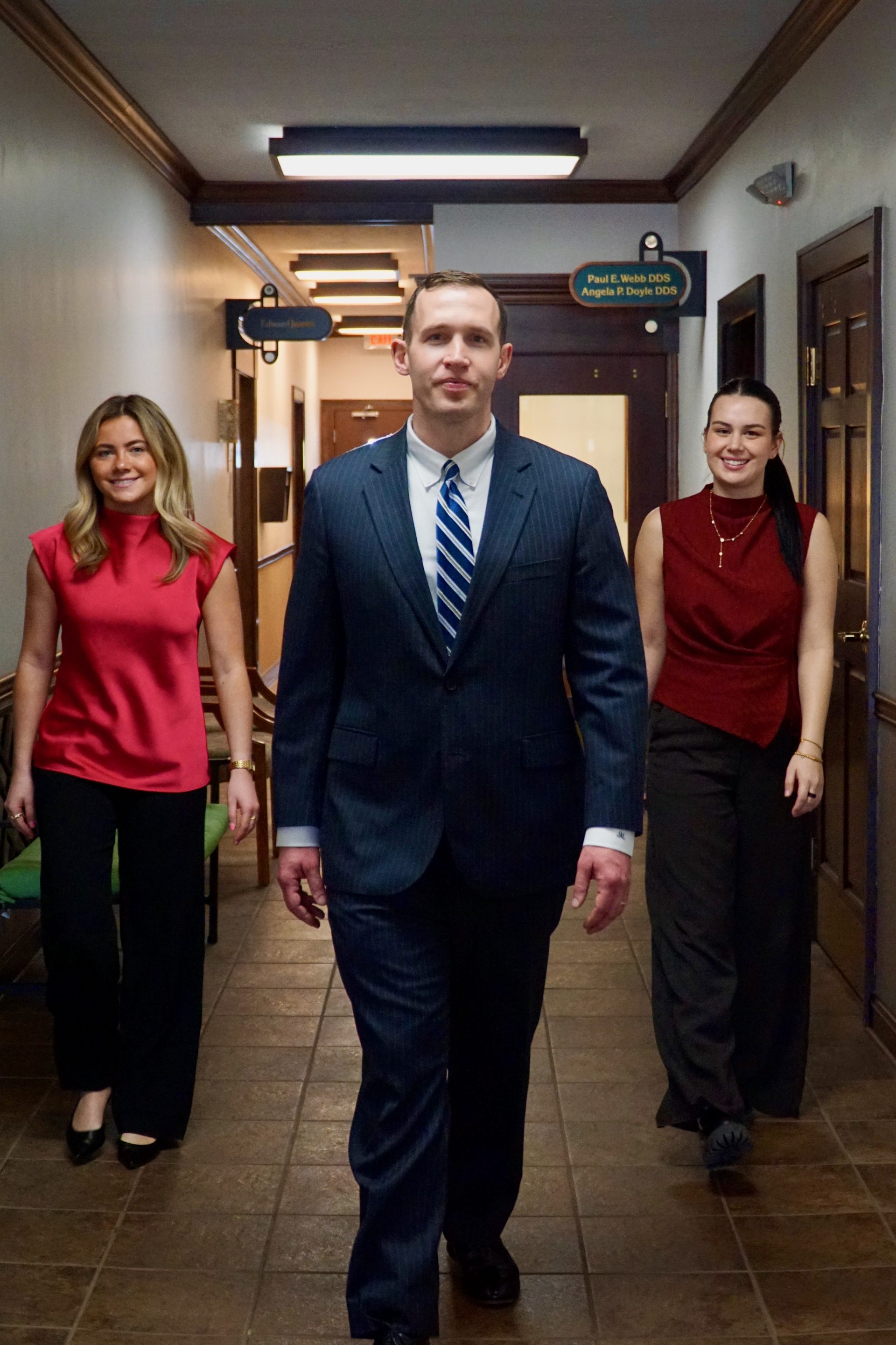 Joe Lotozo and team walking through the Tremont Center hallway