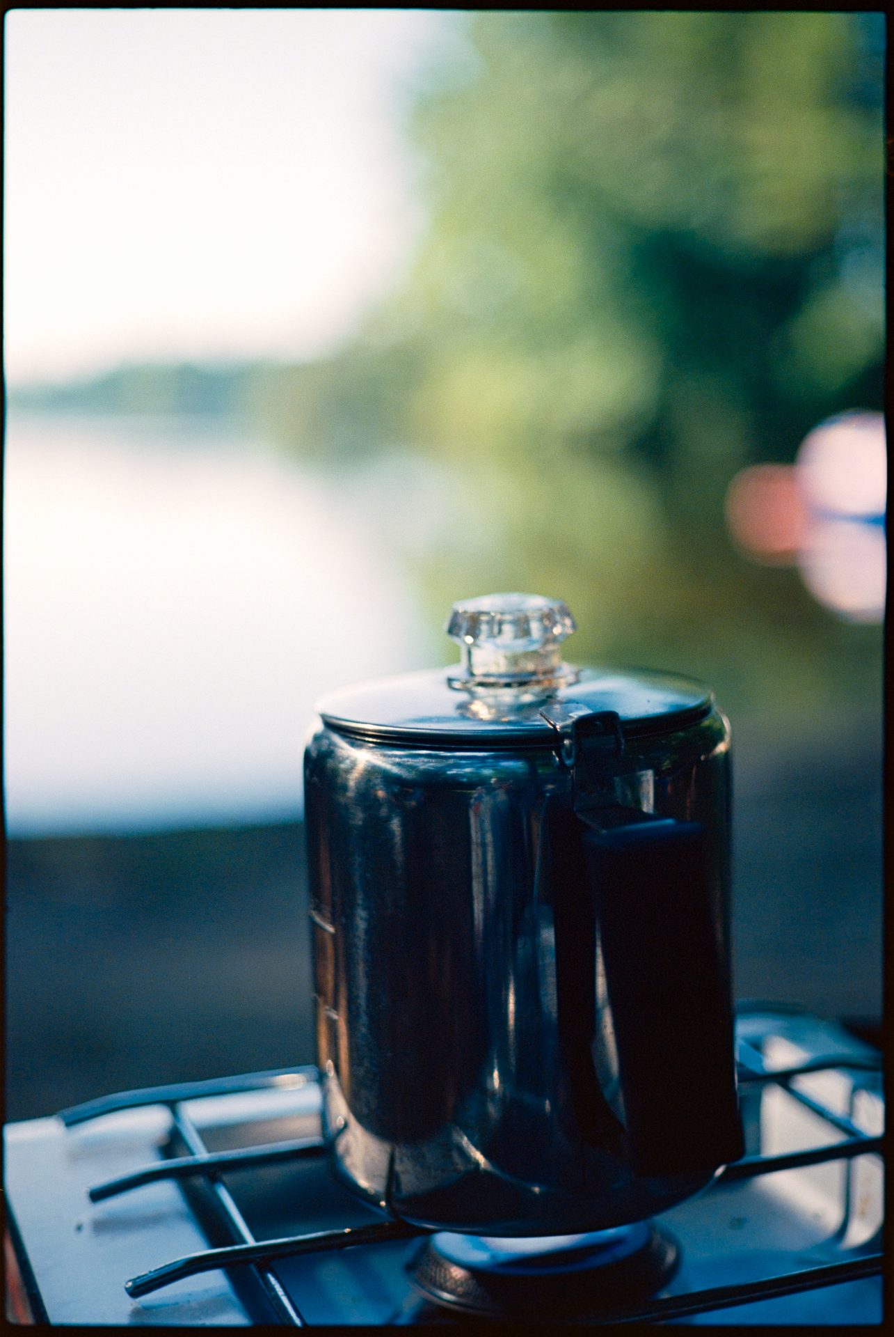 Camp coffee percolator on a camp stove at lakeside, Maine — Kodak Ektar 100