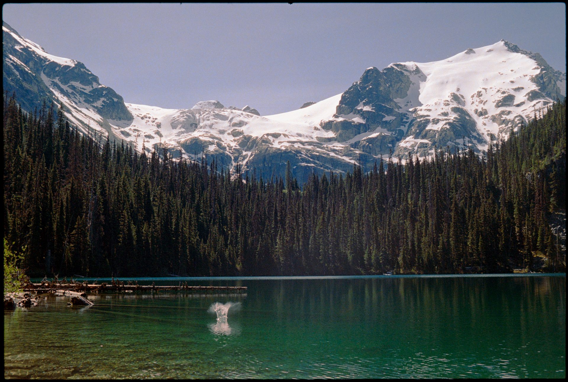 Emerald glacial lake reflecting snow-capped mountains at Whistler — Kodak Portra 800