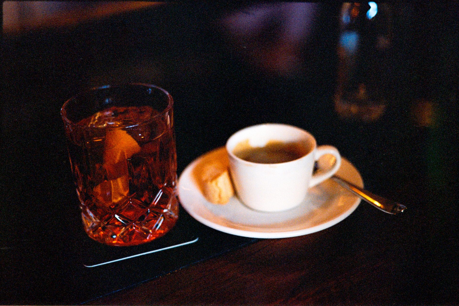 Whiskey on the rocks beside an espresso at a Whistler bar — Kodak Portra 400
